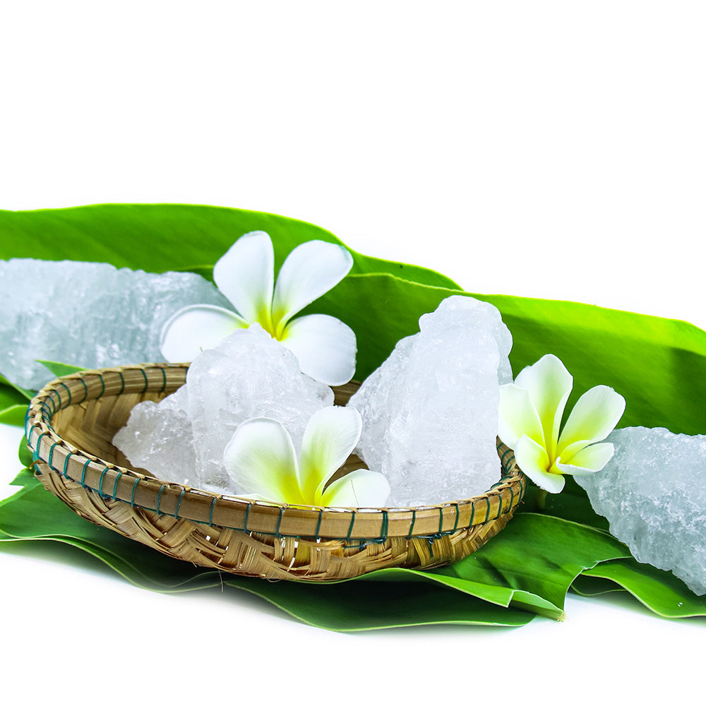 cubes containing camphor and menthol with yellow flowers in basket 