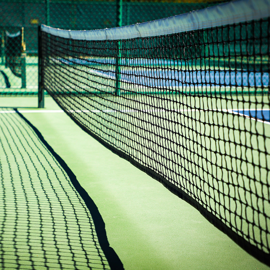 Photo of a net on a pickleball court