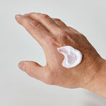 Hand with aulief white cream